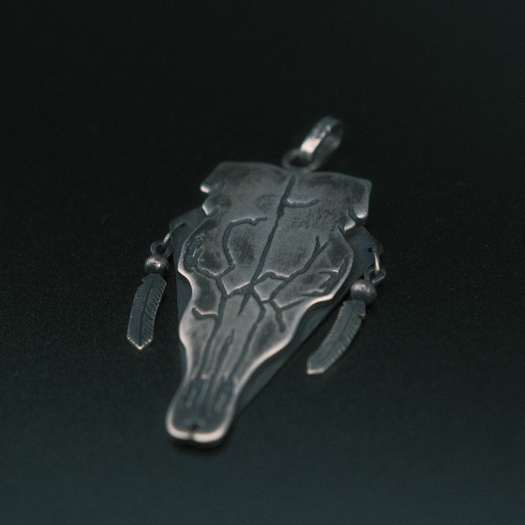 Cow skull pendant