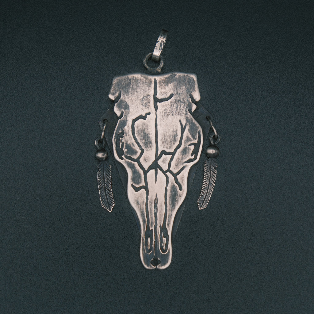 Cow skull pendant
